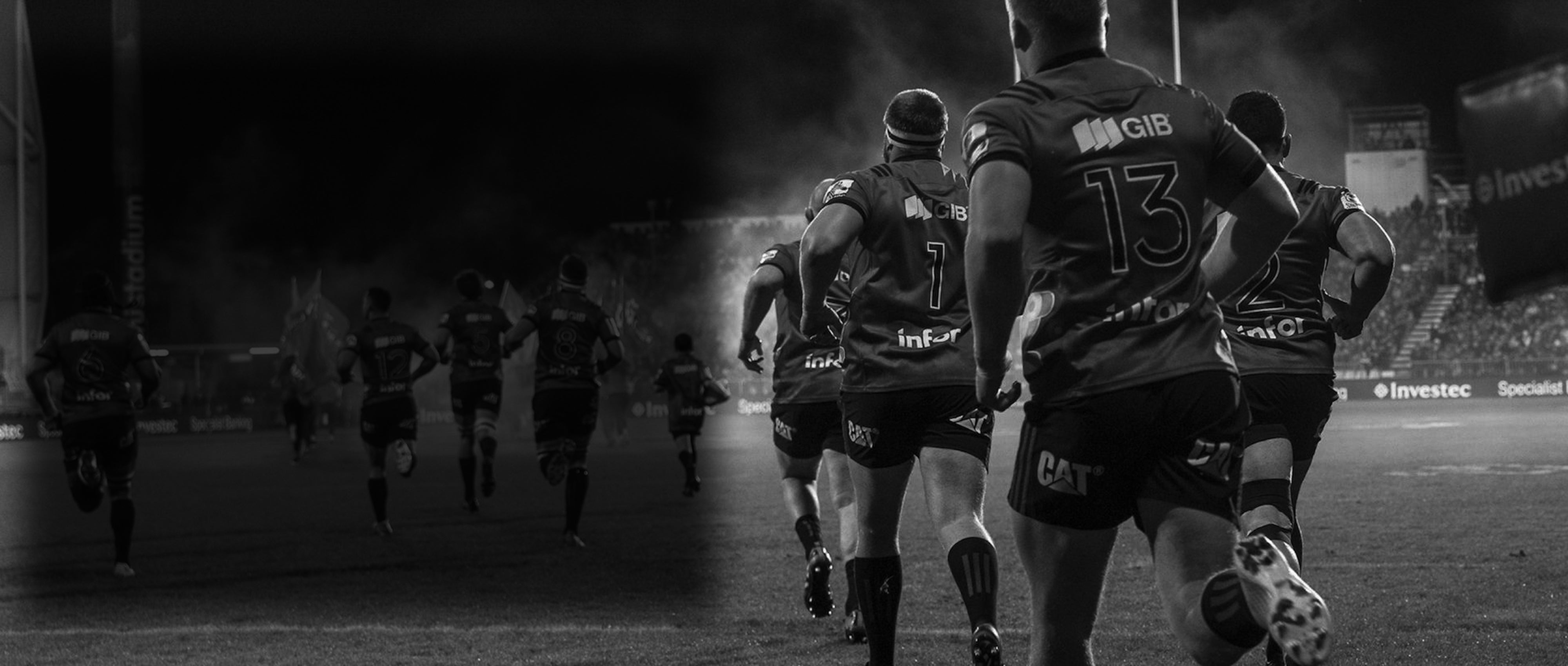 Rugby players running onto the field under stadium lights – Peak Rugby performance and team strength